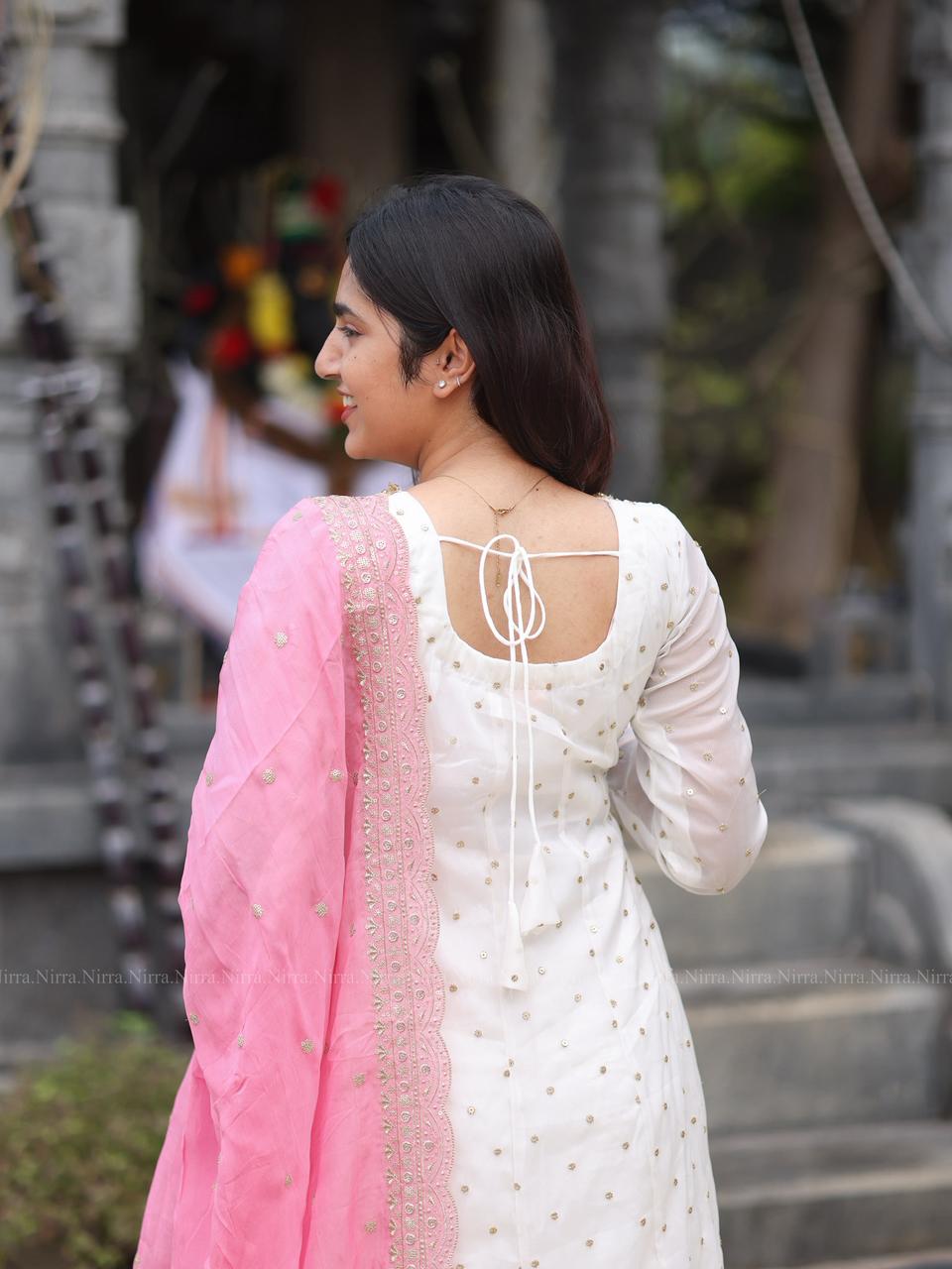 White georgette Anarkali with crystal lace work paired with embroidery baby pink organza shawl