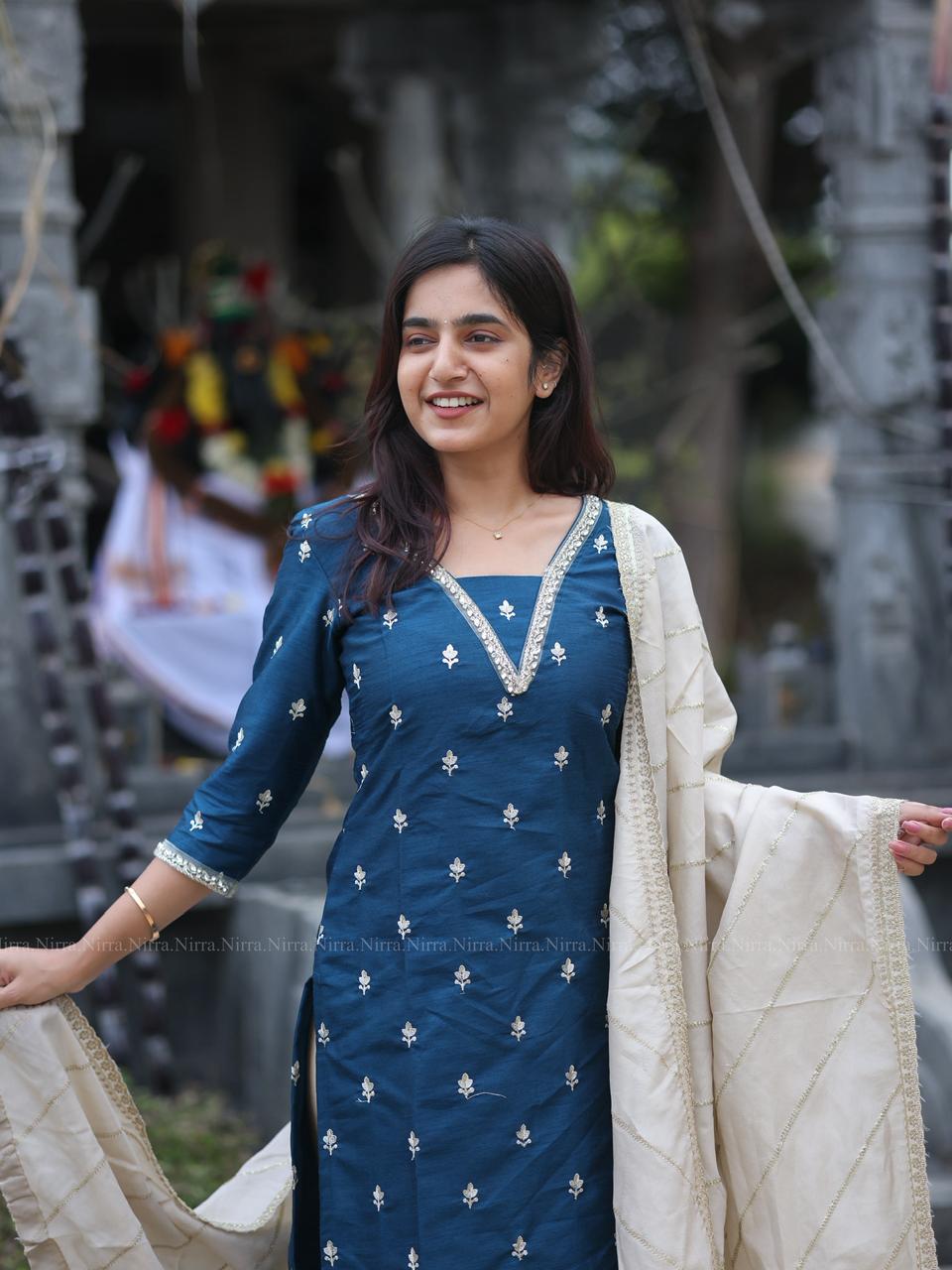 Ink blue raw silk Kurti with crystal lace work paired with silver tissue shawl