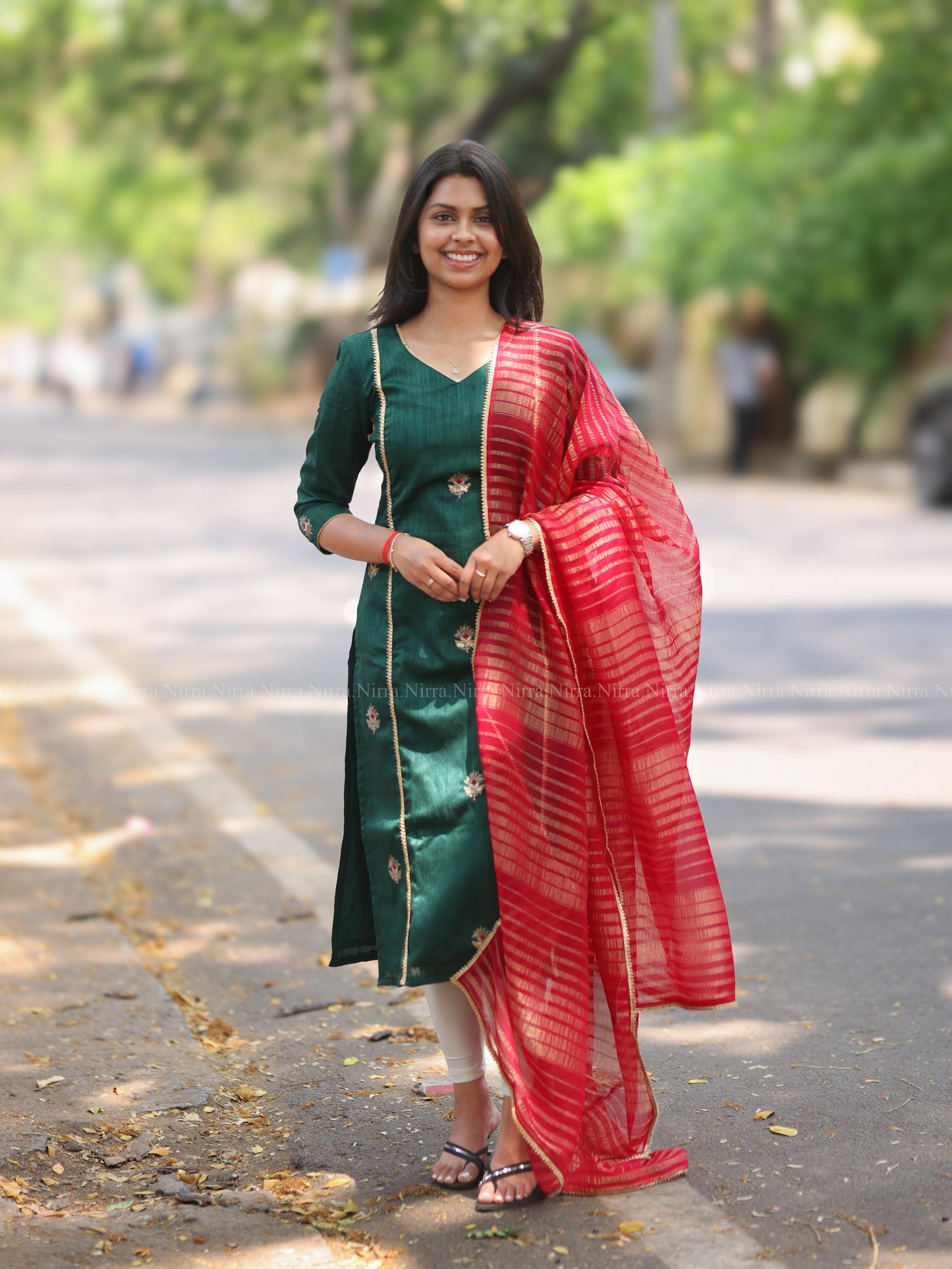 Bottle green embroidery kurti with red tissue shawl