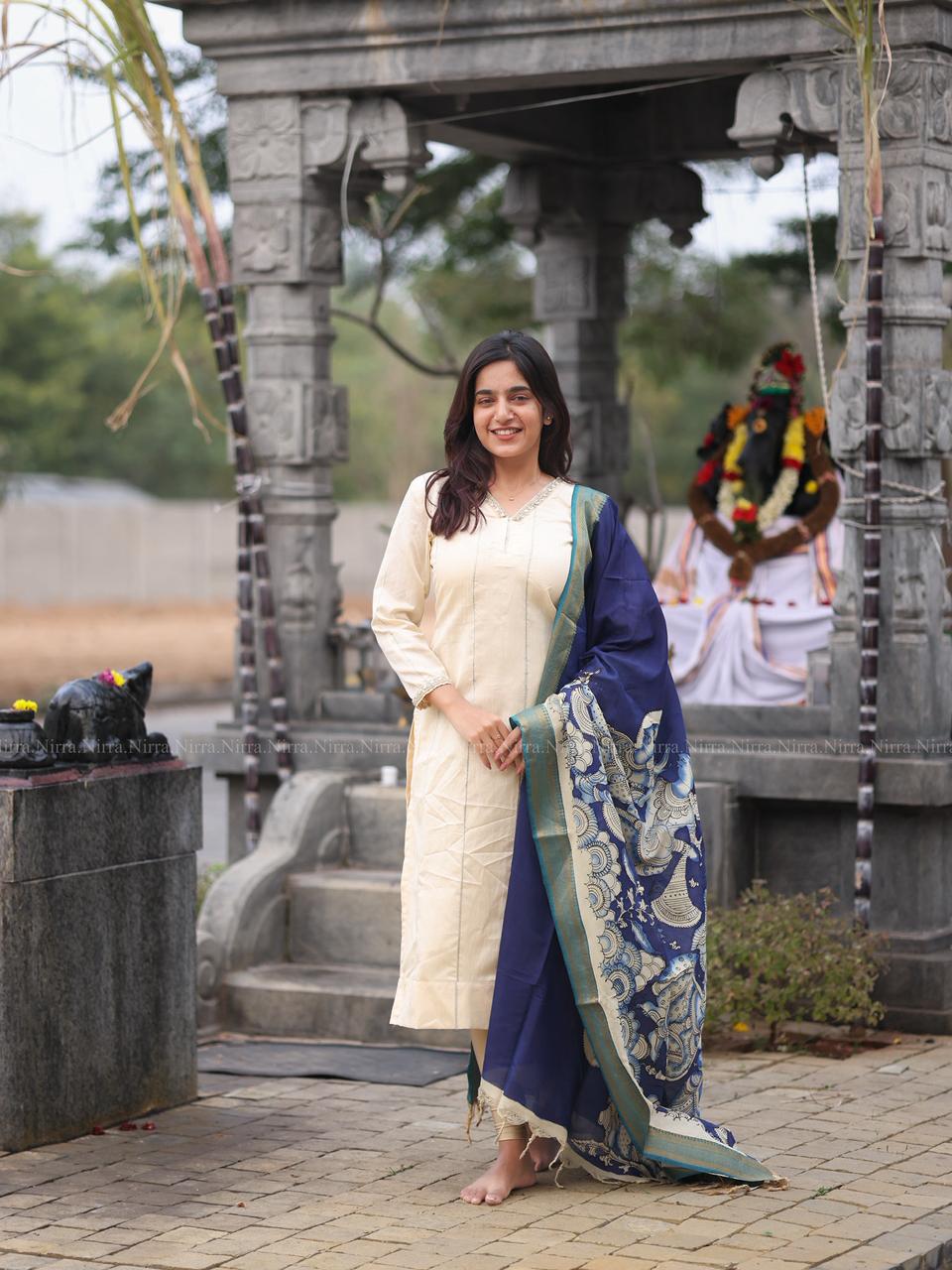 Cream raw silk kurti with crystal lace work paired with ink blue hand painted Kalamkari shawl