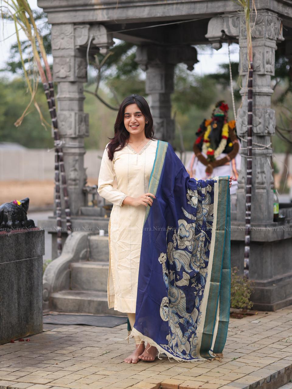 Cream raw silk kurti with crystal lace work paired with ink blue hand painted Kalamkari shawl