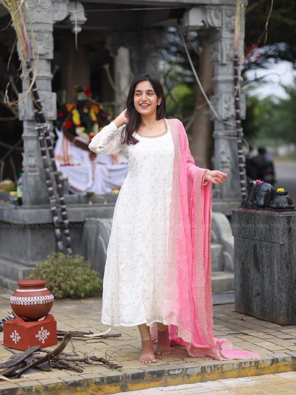 White georgette Anarkali with crystal lace work paired with embroidery baby pink organza shawl