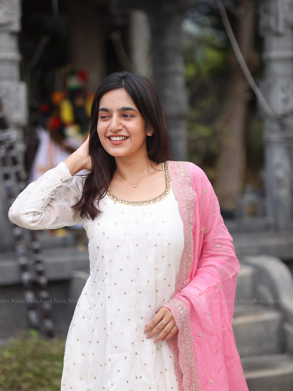 White georgette Anarkali with crystal lace work paired with embroidery baby pink organza shawl