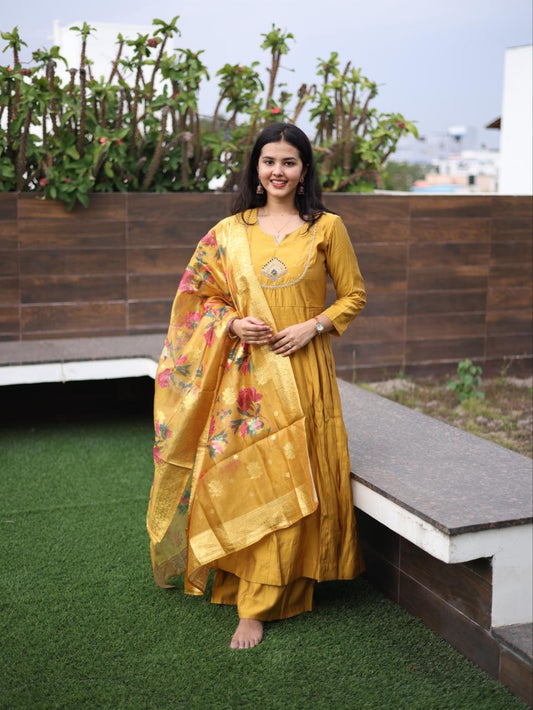 Mustard semi silk Anarkali top with palazzo pants paired with floral organza shawl