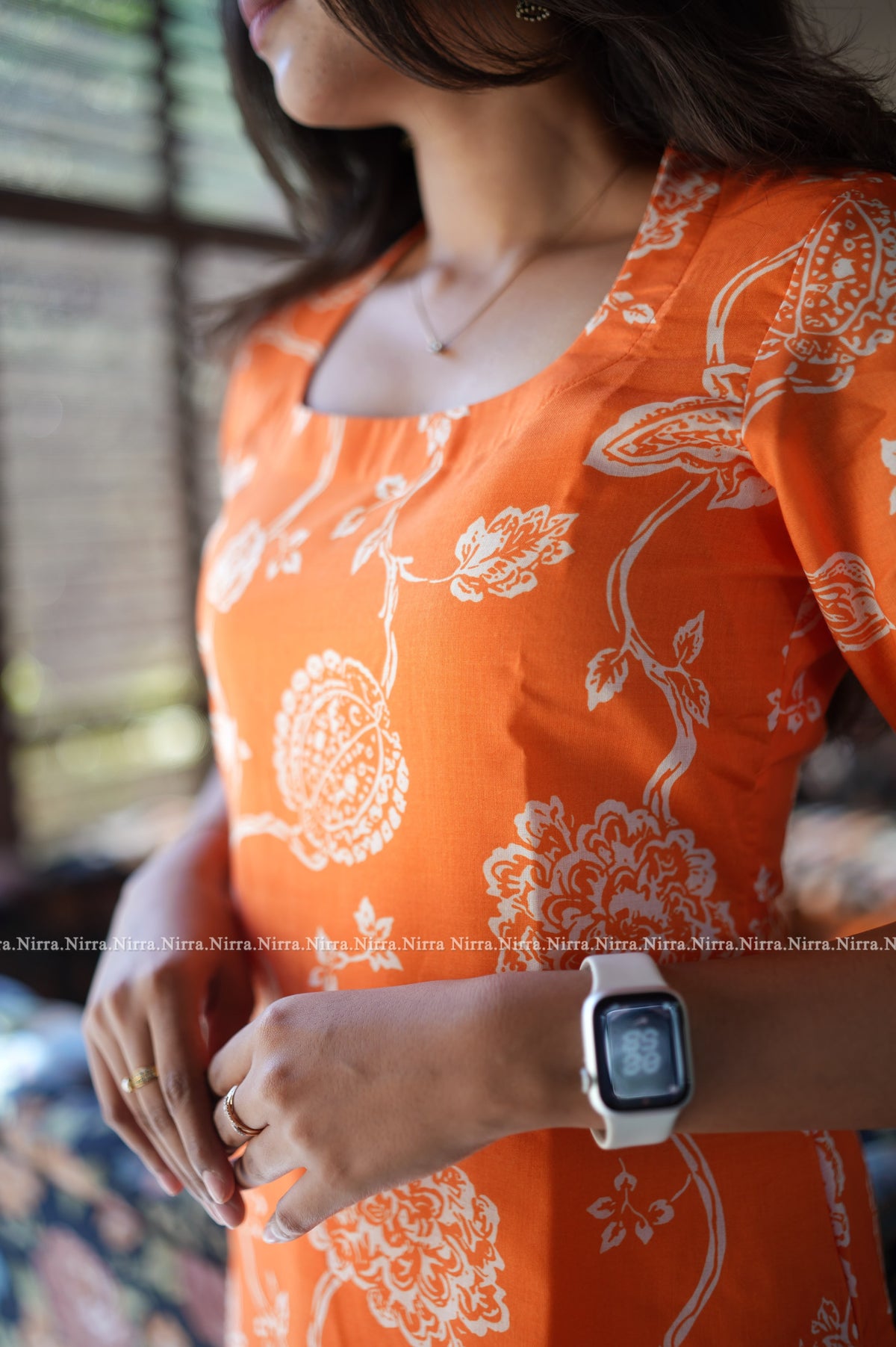 Orange floral print cotton kurti with halter neck