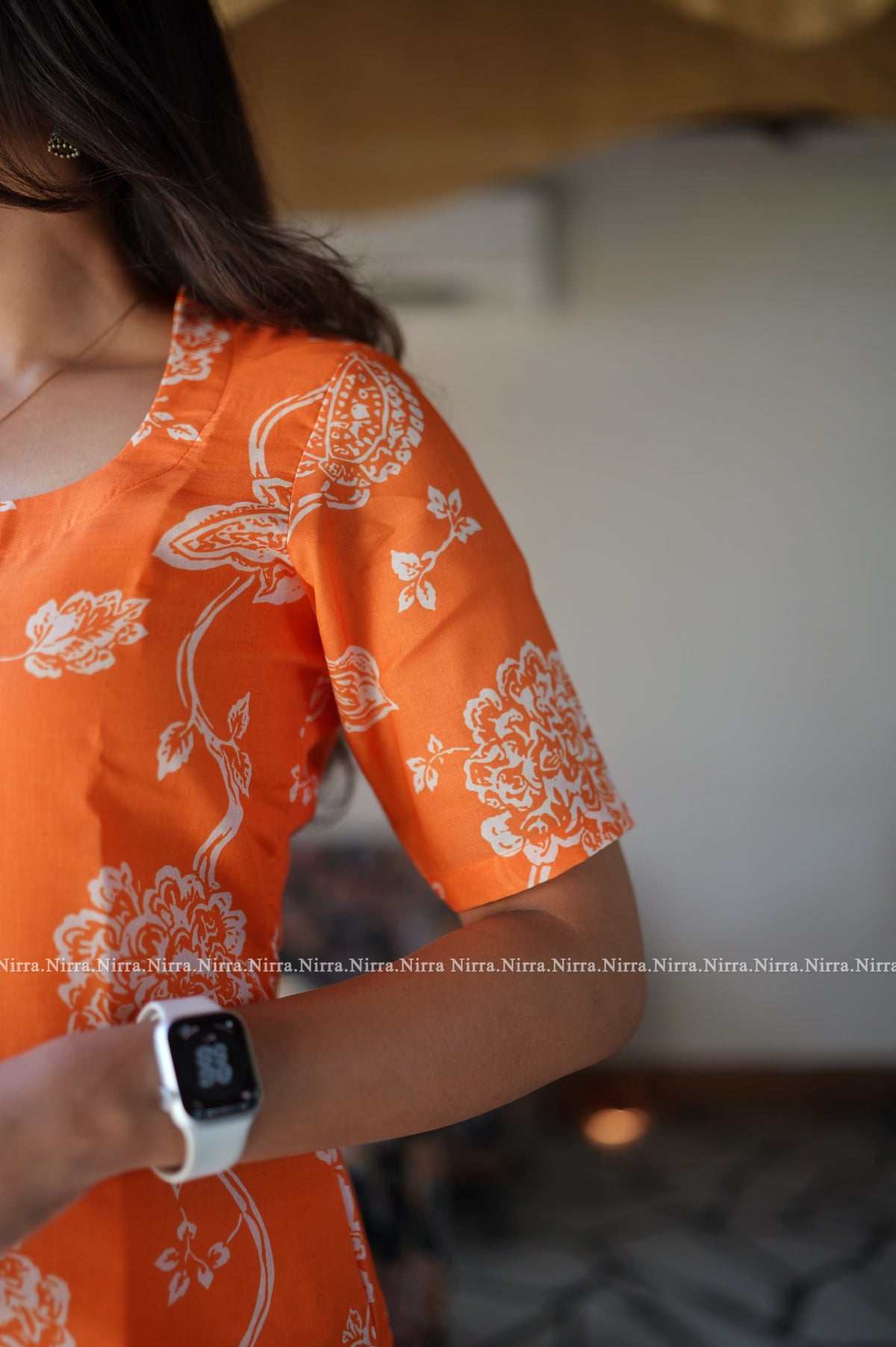 Orange floral print cotton kurti with halter neck