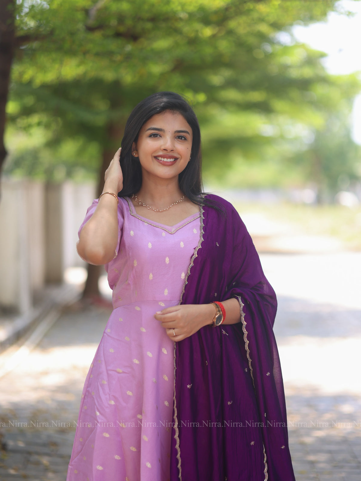 Lilac tissue umbrella cut Anarkali paired with purple vichitra silk shawl