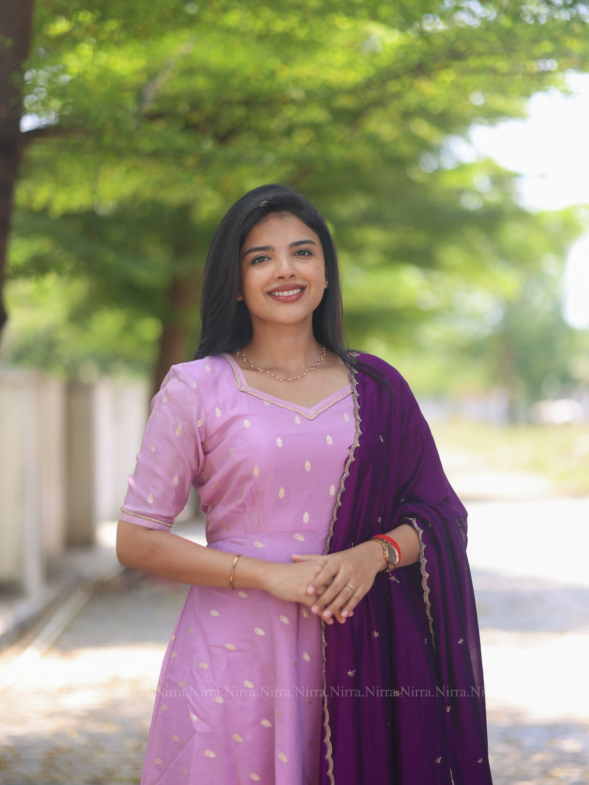 Lilac tissue umbrella cut Anarkali paired with purple vichitra silk shawl