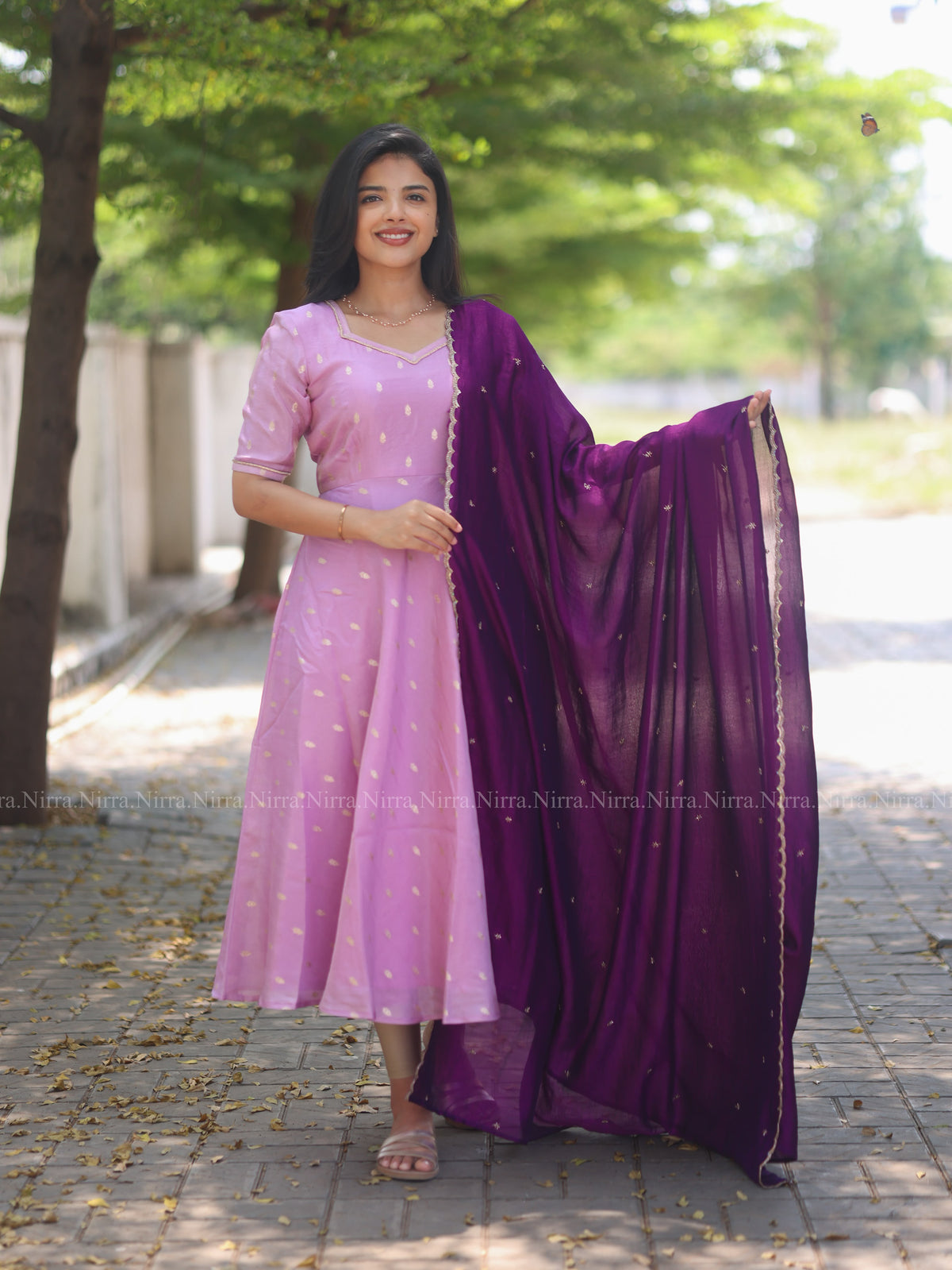 Lilac tissue umbrella cut Anarkali paired with purple vichitra silk shawl