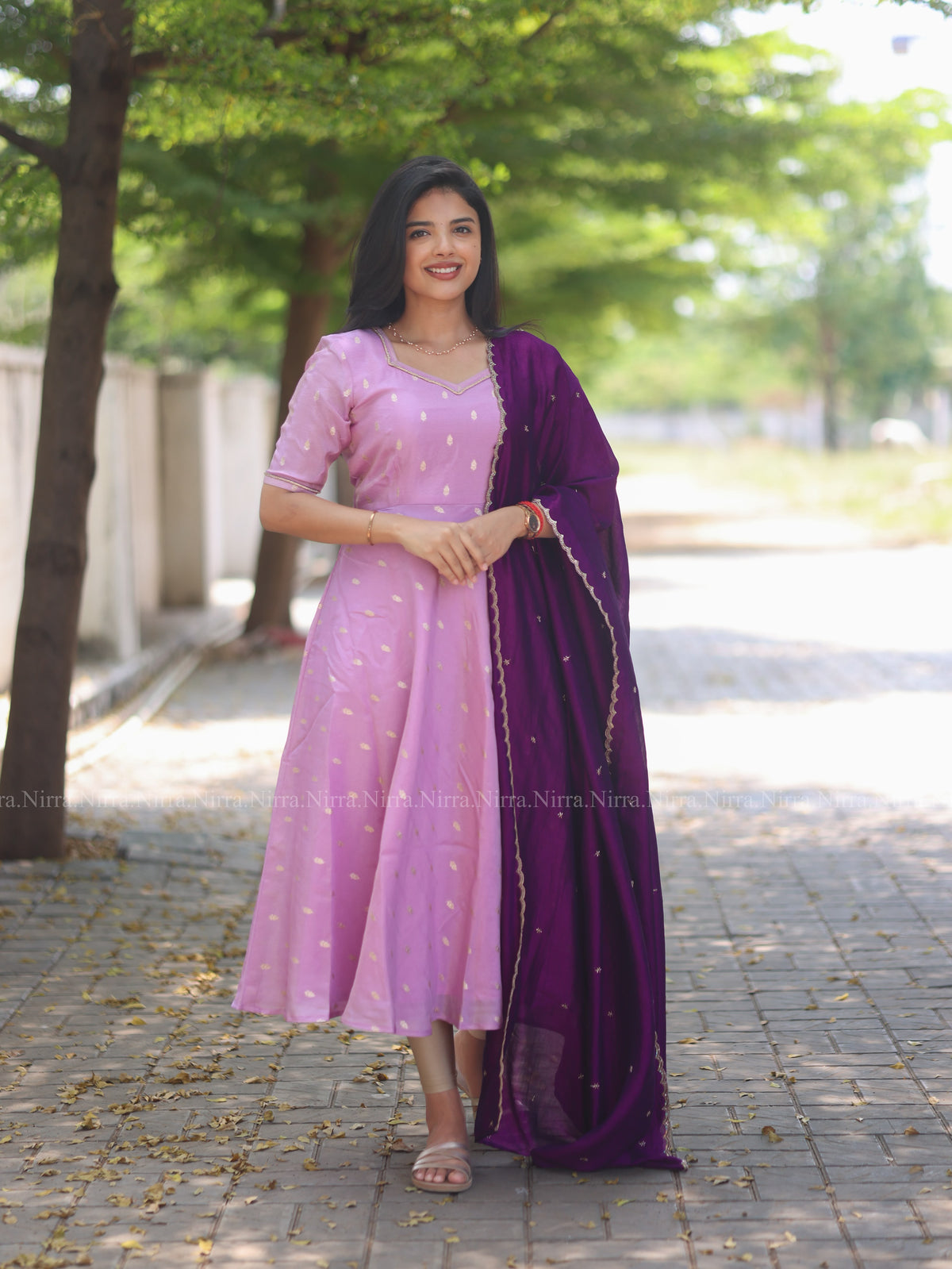 Lilac tissue umbrella cut Anarkali paired with purple vichitra silk shawl